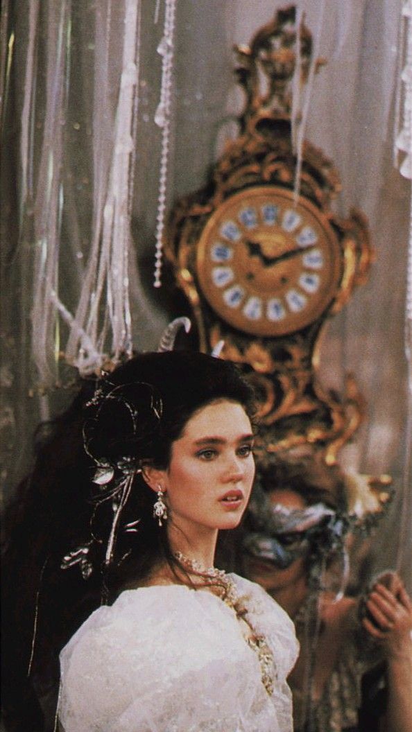 Sarah in her ball gown as she enters the goblin ball for the first time. The thirteen hour clock is behind her.