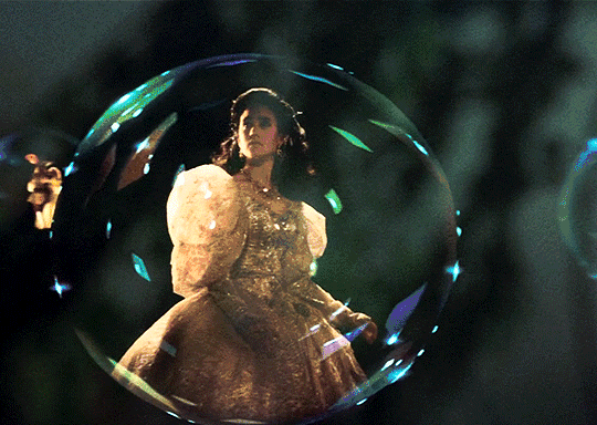 Gif of Sarah in her ballgown inside a bubble before the ballroom scene begins
